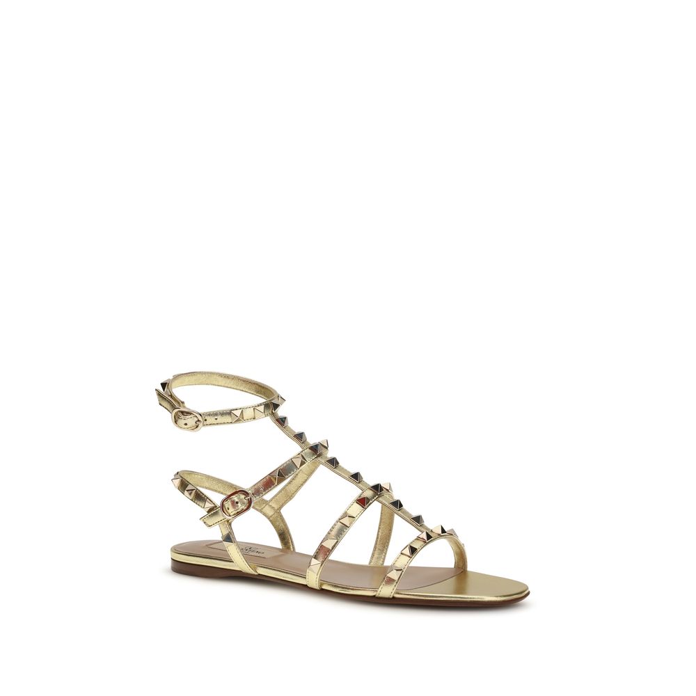 Valentino Garavani Bos Taurus Flat Sandals in Goud Kalfsleer