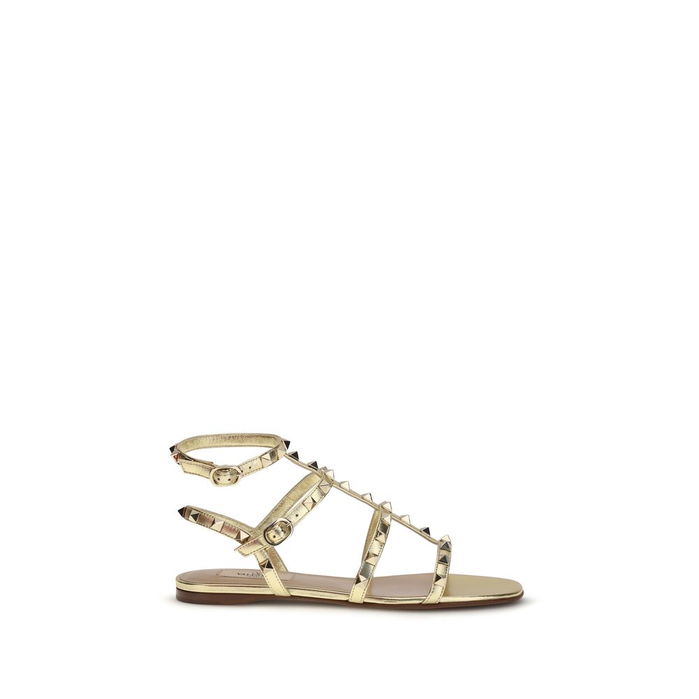 Valentino Garavani Bos Taurus Flat Sandals in Goud Kalfsleer